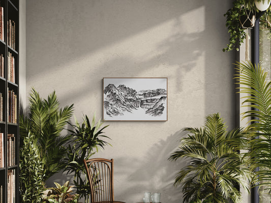 Peinture en noir et blanc à l encre de chine du Cirque de gavarnie dans les Pyrénées, classé au patrimoine mondial de l UNESCO. Ce tirage d art au format A3 en noir et blanc est encadré dans une biblitothèque et salon lumineux et chaleureux, entouré par les plantes il ajoute une touche de sophistication à cet espace naturel et cosy pour une décoration chaleureuse à l'arrivée de l'automne.